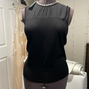 Elegant black sleeveless blouse